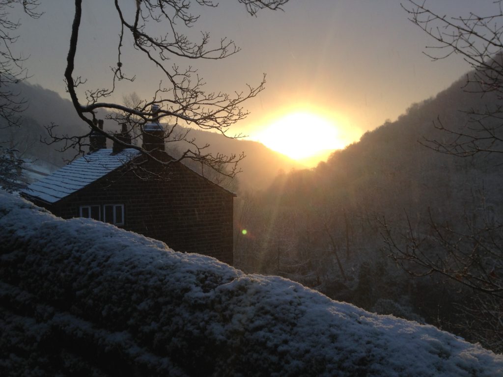 Sunrise over Lumb Bank valley in snow