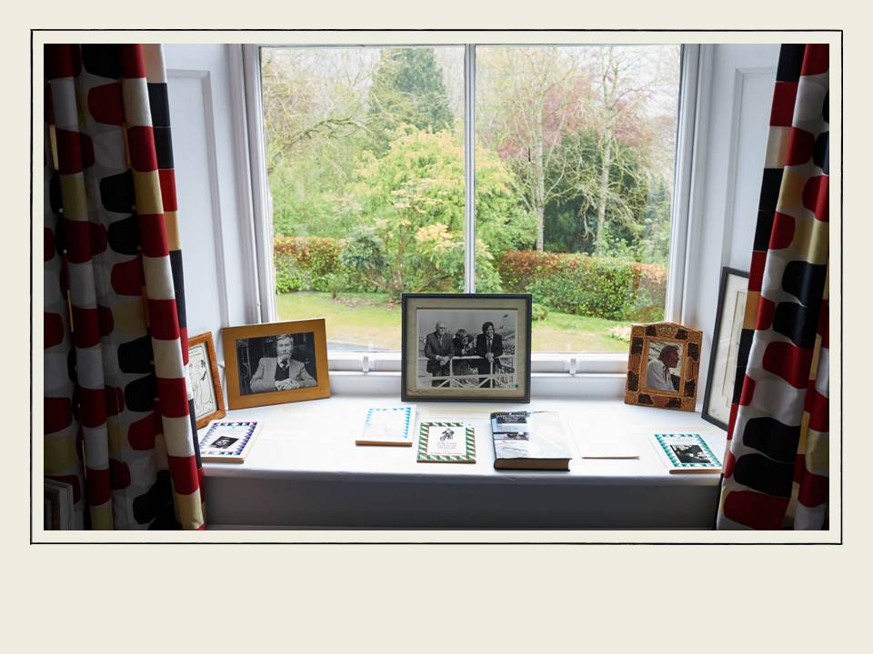 Collection of John Osborne photos on window at The Hurst